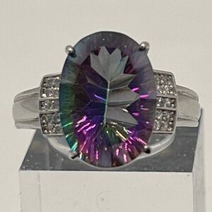 Concave-cut Oval Mystic Quartz, Banded CZ’s on each side. Rhodium over S925.
